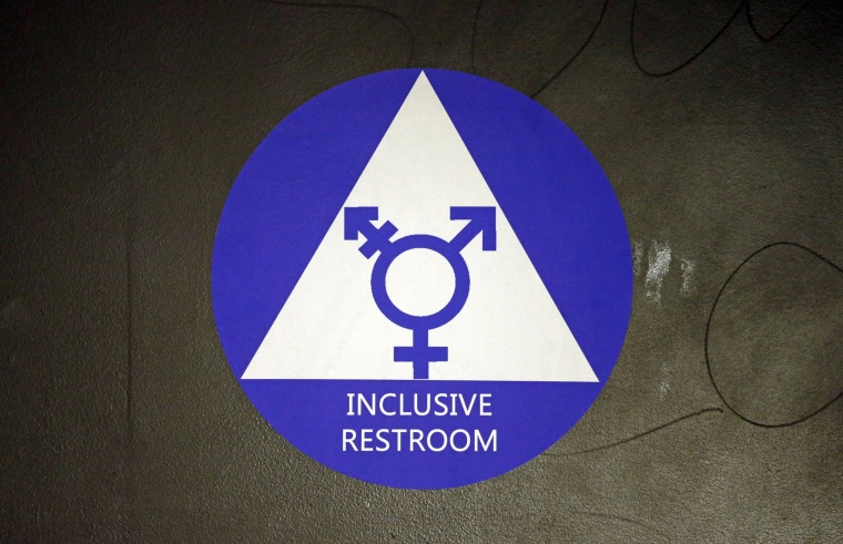 Image: A new sticker designates a gender neutral bathroom at a high school in Seattle.