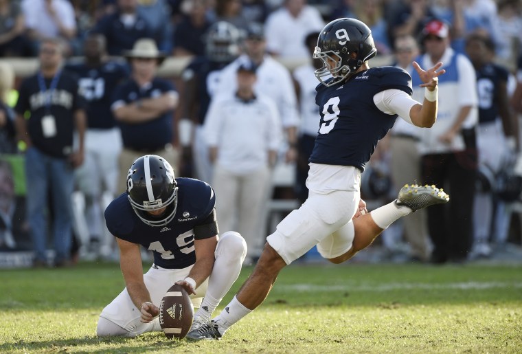 Image: Punter Ryan Nowicki #49 of the Georgia Southern Eagles holds the ball for kicker Younghoe Koo #9, right, during a field goal attempt