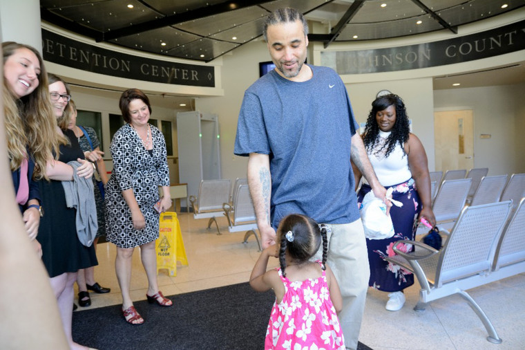 Image: Richard Jones reconnects with family after being released from prison.