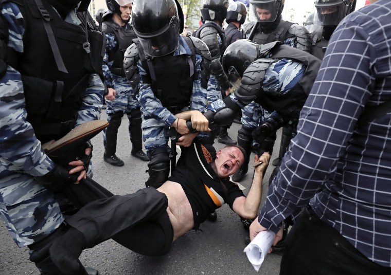 Image: Russian police officers detain a participant of an unauthorized opposition rally