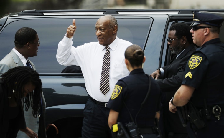Image: Bill Cosby gives a thumbs up as he arrives at his sexual assault trial