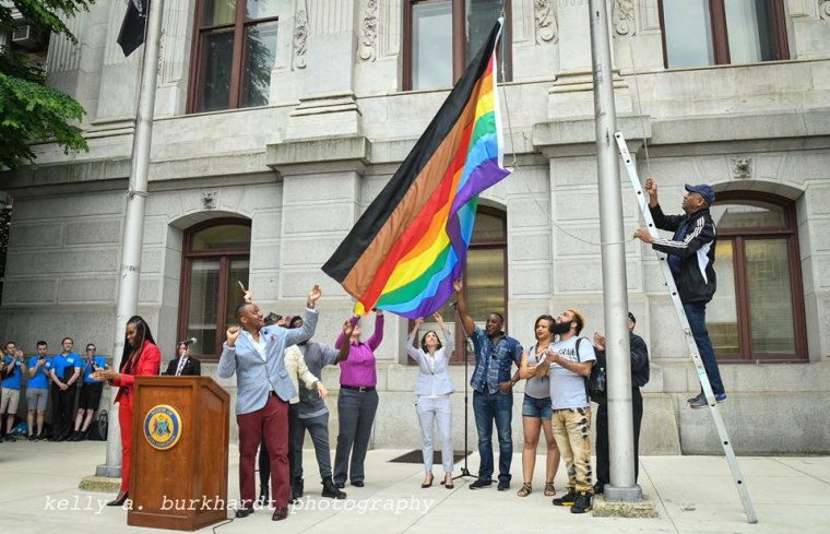 Philadelphia's new rainbow Pride flag, which includes black and brown stripes, is raised at City Hall in June 2017