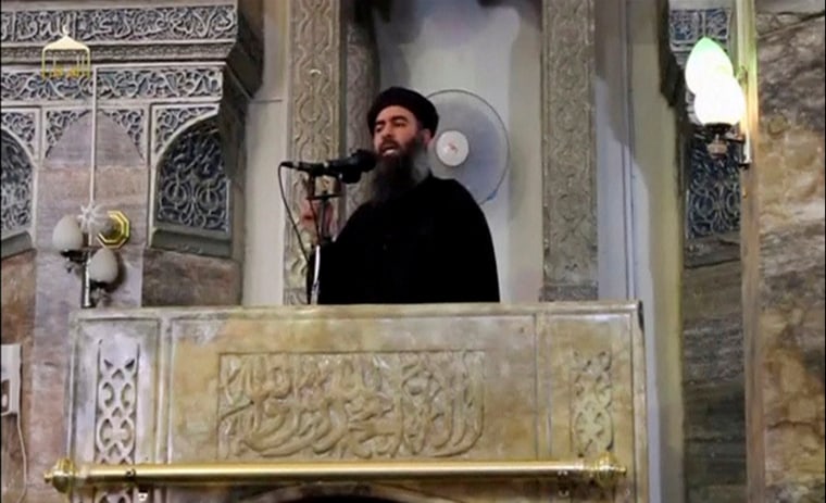 Image: Abu Bakr al-Baghdadi making what would have been his first public appearance, at a mosque in the center of Mosul