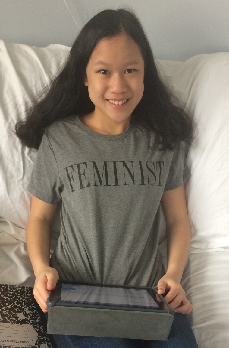 Cordelia Longo wearing a shirt with the word "feminist" in capital letters.