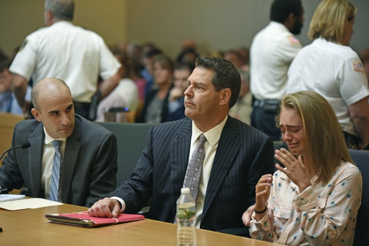 Image: Michelle Carter, right, seated with her attorneys Cory Madera, left, and Joseph Cataldo