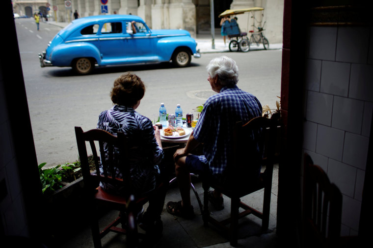 Image: Tourists eat in a restaurant in Havana, Cuba