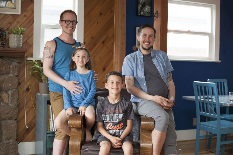 Fathers Biff Chaplow (left) and Trystan Reese (right) with their children Hailey and Riley