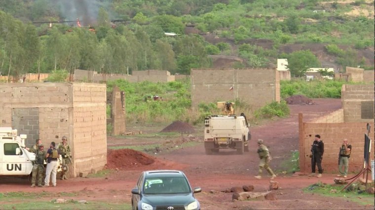 Image: An armoured vehicle drives towards Le Campement Kangaba resort following an attack where gunmen stormed the resort in Dougourakoro, to the east of the capital Bamako, Mali in this still frame taken from video