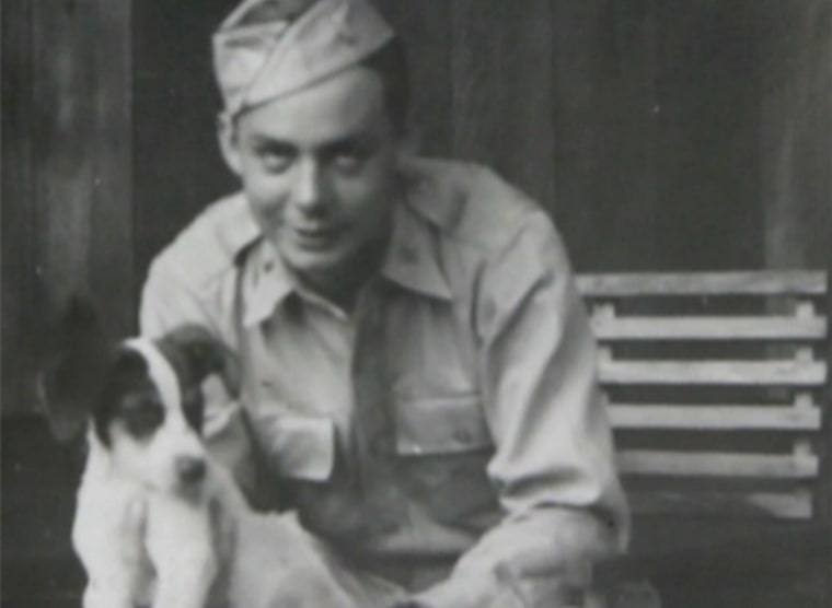 Russ Gremel with Rebel the dog, in Hawaii in 1941.