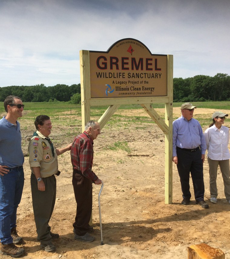 Russ Gremel at the sign for the Gremel Wildlife Sanctuary.