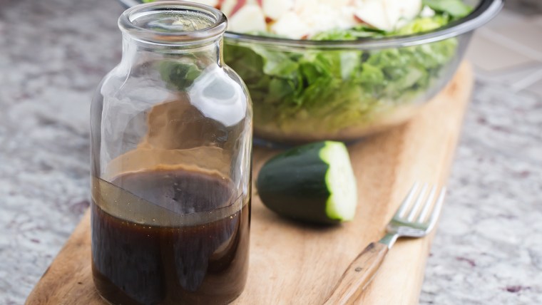 a glass bottle with salad dressing consisting of balsamic vinegar, honey and olive oil; Shutterstock ID 550040071; PO: Today
