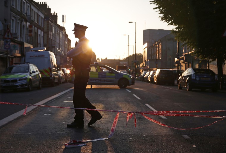 Image: A police officer guards a street in the Finsbury Park area