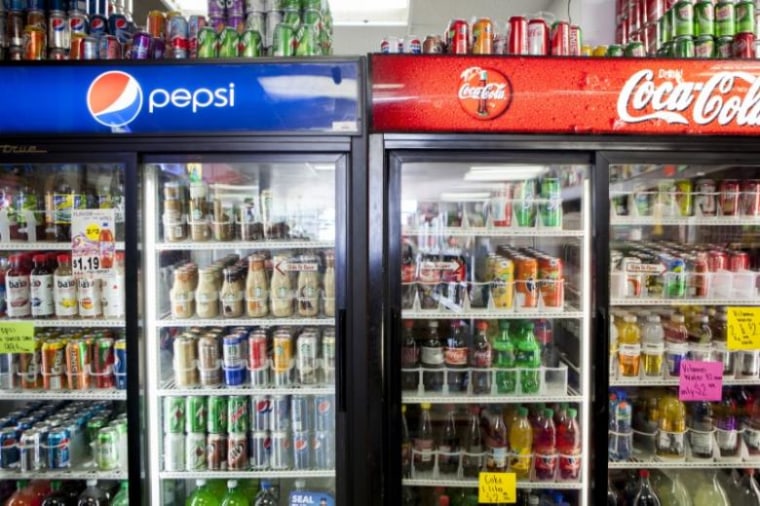 Cans of soda are displayed in a case at Kwik Stops Liquor in San Diego