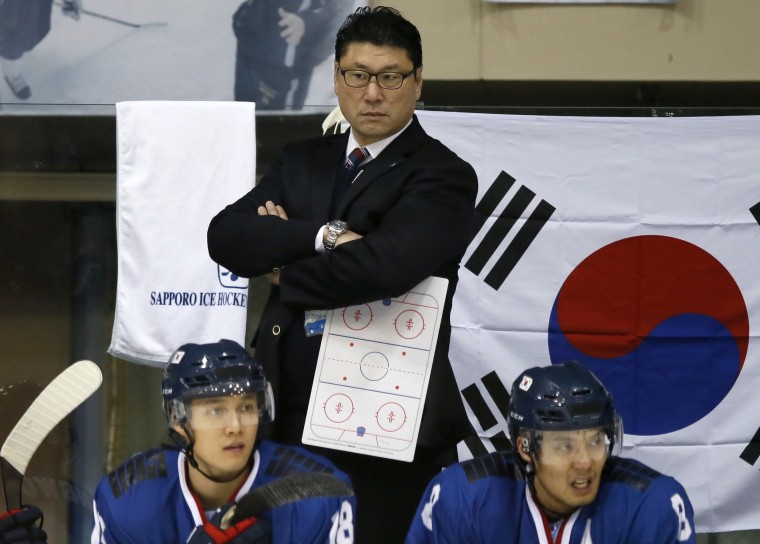 In this Feb. 22, 2017 photo, South Korea's head coach Jim Paek watches the ice hockey men's top division match against Kazakhstan at the Asian Winter Games in Sapporo, northern Japan. Former NHL defenseman Paek was hired to coach the team.  Paek, the first Korean-born hockey player to play in the NHL, won two Stanley Cups with the Pittsburgh Penguins in 1991 and 1992.