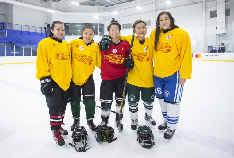 A group of female hockey players of Chinese descent participating in a training camp hosted by the China national hockey team.