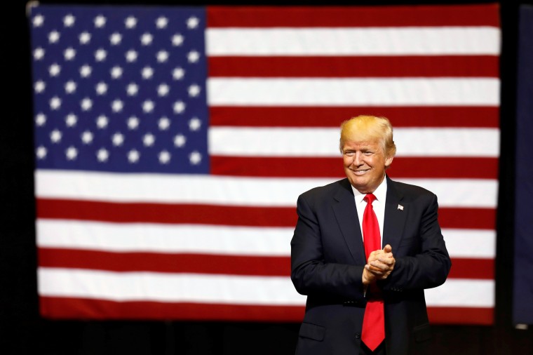 Image: Trump takes the stage for a rally in Cedar Rapids, Iowa