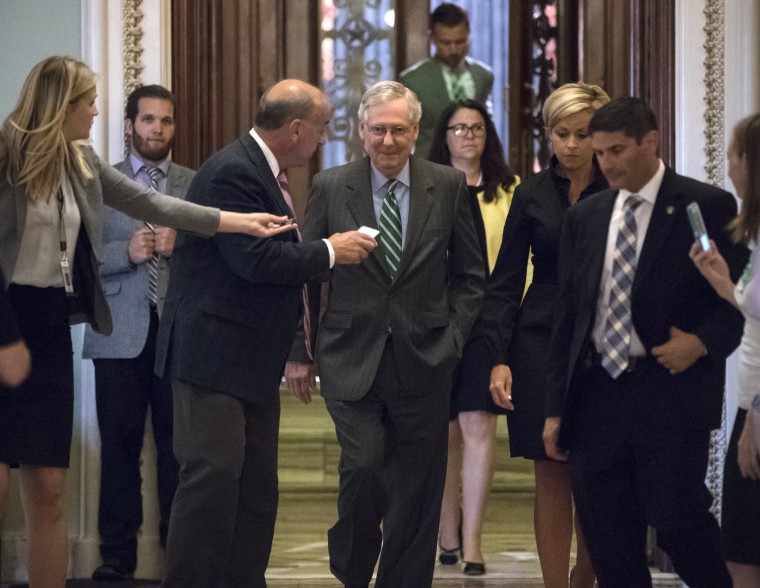 Image: McConnell leaves the chamber after announcing the release of the Republicans' healthcare bill