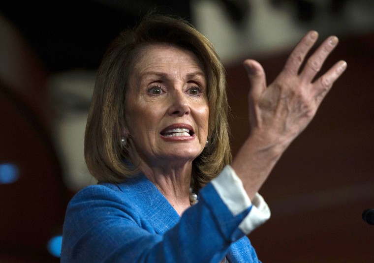 Image: House Minority speaker Nancy Pelosi gestures during a press conference