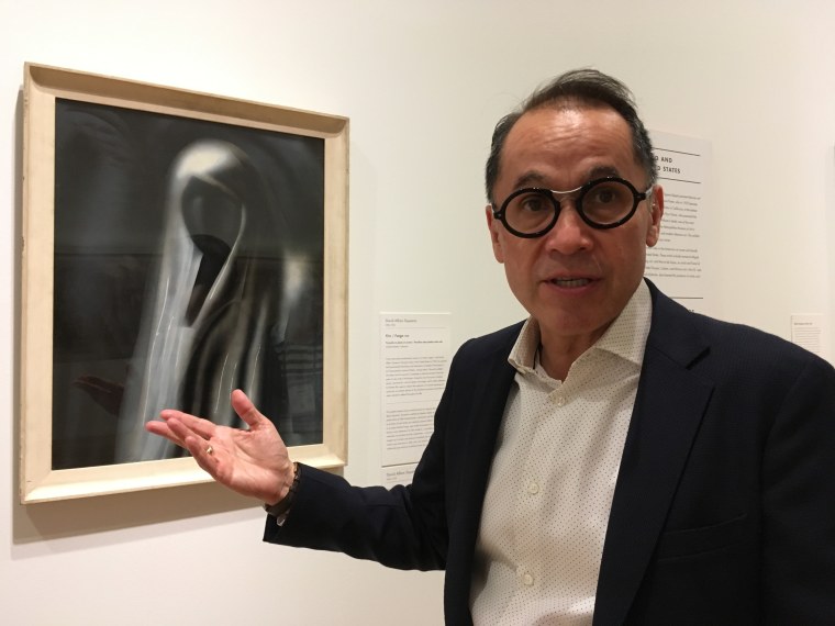 Agustin Arteaga, Dallas Museum of Art director, stands before a painting by David Alfaro Siqueiros in June 2017.