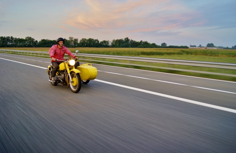 Leon Logothetis traveled in a yellow motorbike in "The Kindness Diaries"