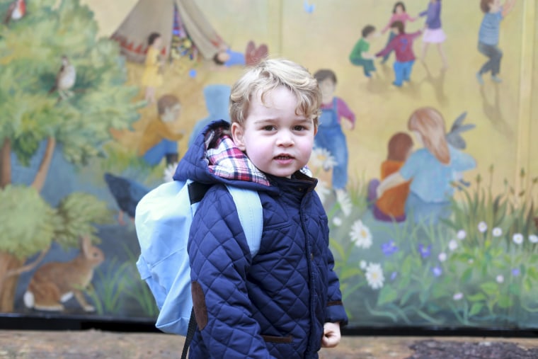 Image: Britain's Prince George stands outside the Westacre Montessori School nursery in King's Lynn