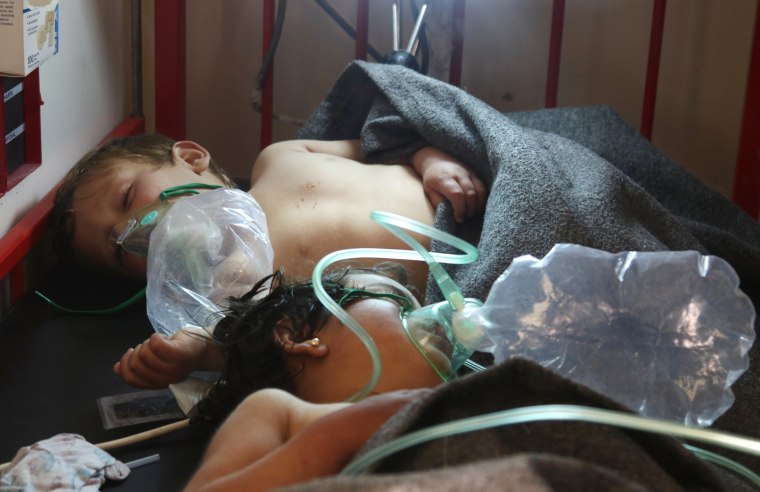 Image: Syrian children receive treatment at a small hospital in the town of Maaret al-Noman