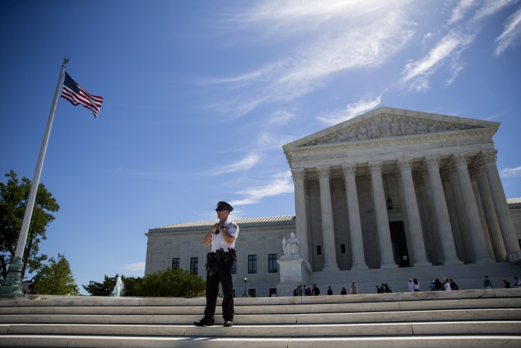 Image: A police officer stands outside the U.S. Supreme Court