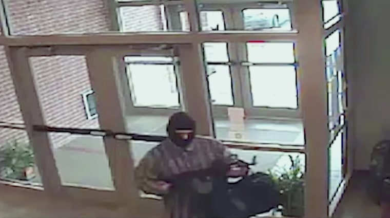 Image: A suspect known as the AK-47 Bandit appears in surveillance video