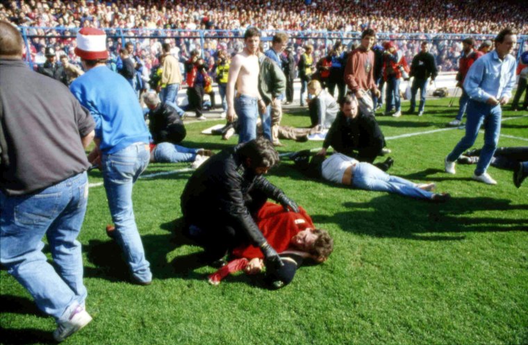 Image: Victims are assisted at Hillsborough Stadium