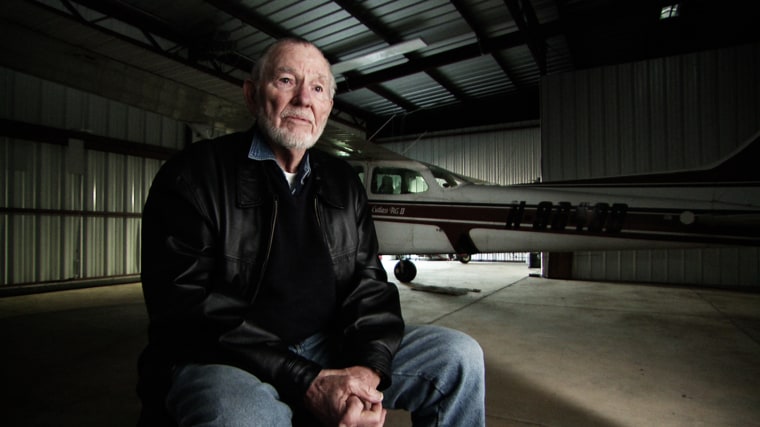Image: John Billings sits in front of his Cessna