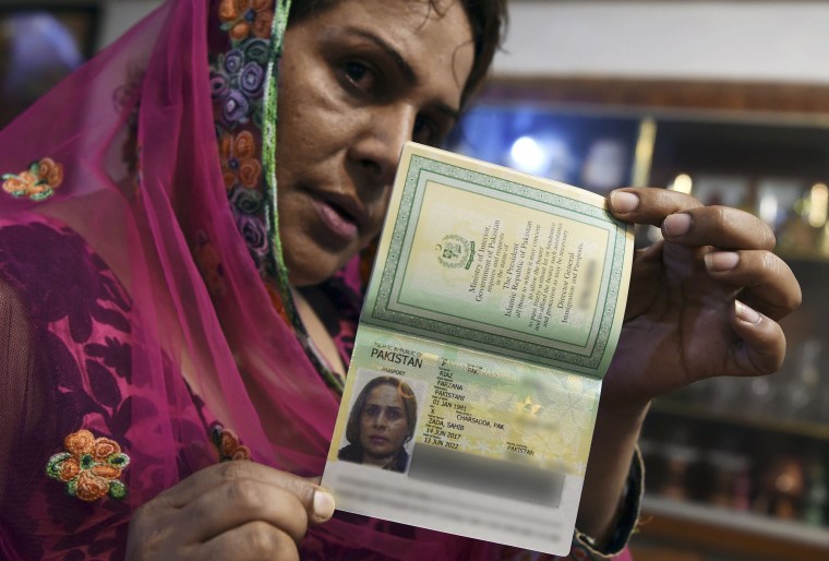Image: Pakistani transgender Farzana Riaz displays her newly-obtained passport in Peshawar on June 28, 2017.