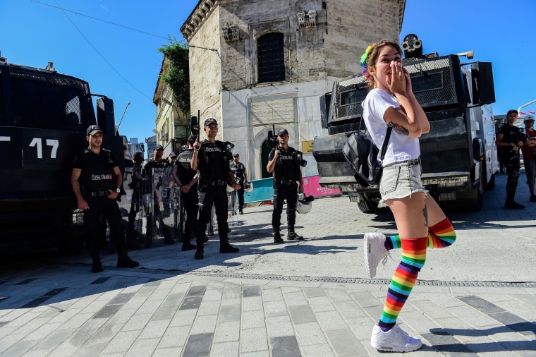 Image: Turkish riot police officers block access to Istikjlal avenue as LGBT rights activist try to gather for a parade