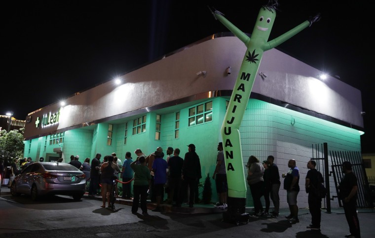 People line up at the NuLeaf marijuana dispensary, Saturday, July 1, 2017, in Las Vegas.