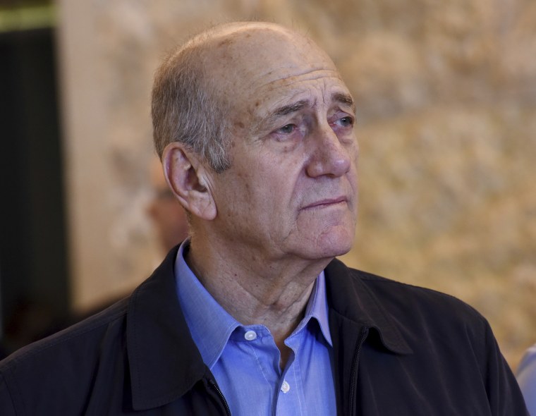 FILE -- In this Dec. 29, 2015 file photo, former Israeli Prime Minister Ehud Olmert leaves the courtroom of the Supreme Court after the court ruled on his appeal in the Holyland corruption case in Jerusalem.