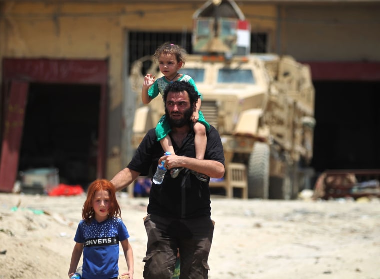 Image: Civilians flee the Old City 