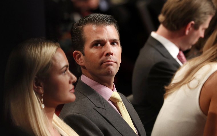 Image: Donald Trump Jr. sits between his wife Vanessa and his brother Eric during the third and final debate between Republican U.S. presidential nominee Trump and Democratic nominee Clinton in Las Vegas