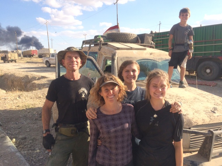 Image: Dave Eubank, his wife, Karen, and their children Sahel, Suuzanne and Peter, in front of their armoured ambulance in western Mosul