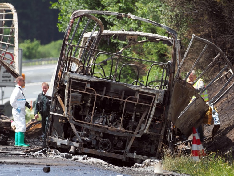 Image: Forensic experts at scene of the tour bus crash near M?nchberg, Germany.