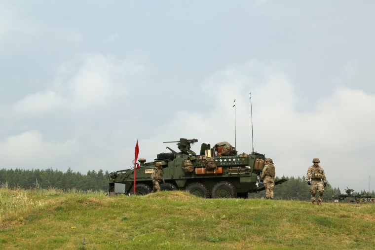 Image: U.S. Army soldiers move an armored Stryker vehicle into position during live-fire training.