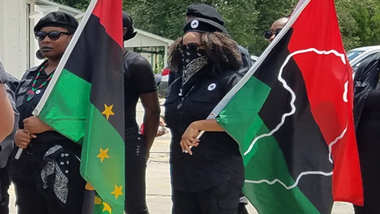 Image: Protesters pushed through the barricade in front of the Baton Rouge Police Department on July 5, 2017 during an Alton Sterling anniversary march.