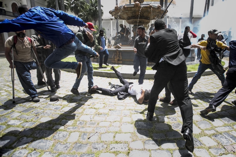 Image: Government supporters break into Venezuelan Parliament and wound deputies