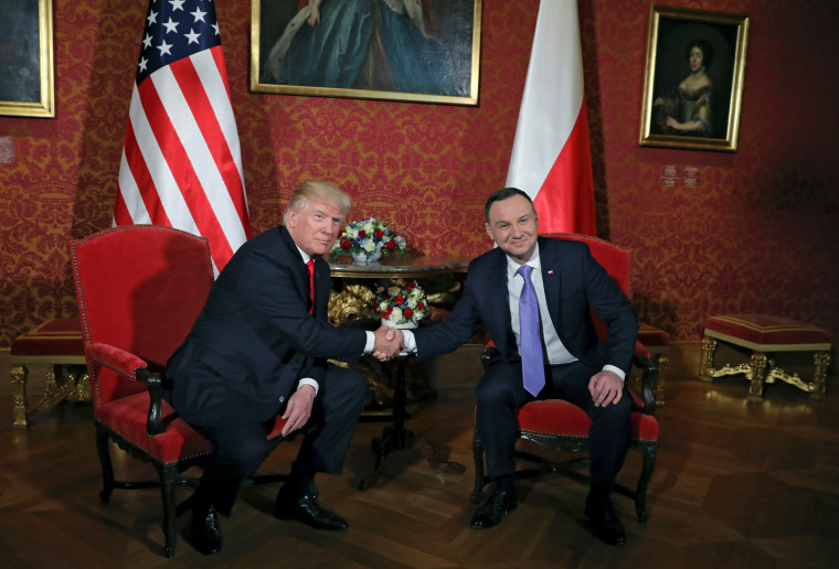 Image: U.S. President Donald Trump shakes hands with Polish President Andrzej Duda in Warsaw