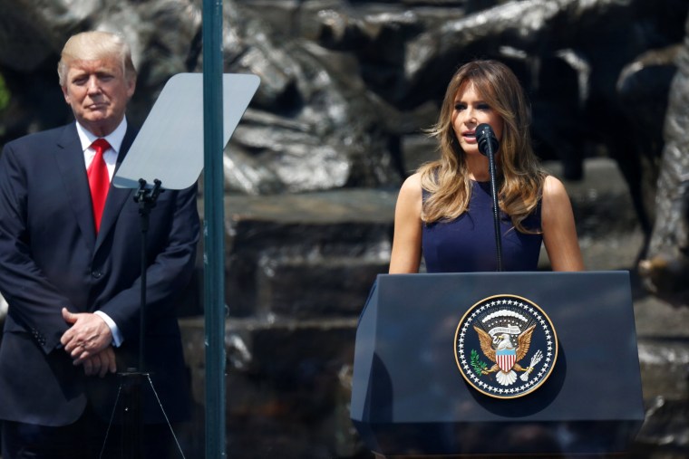 Image: Melania Trump delivers a speech next to President Donald Trump in front of the Warsaw Uprising Monument