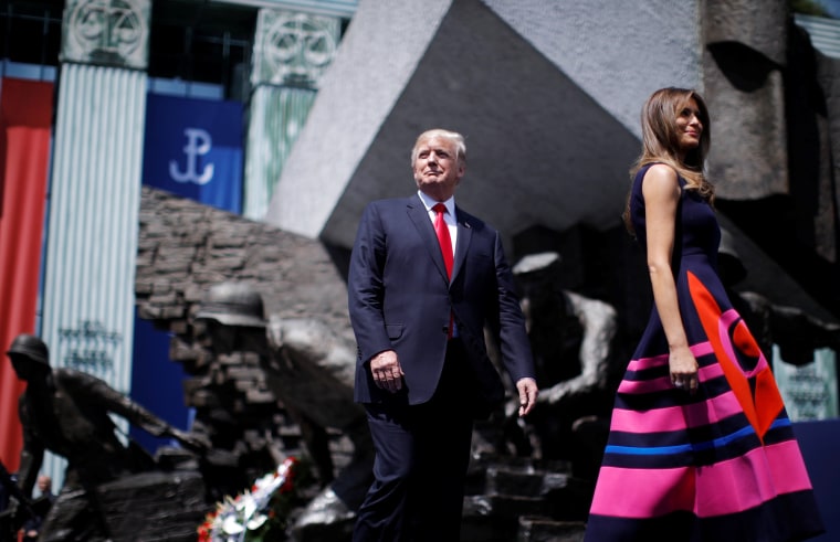 Image: Trump and first lady Melania Trump walk to the podium at Krasinski Square