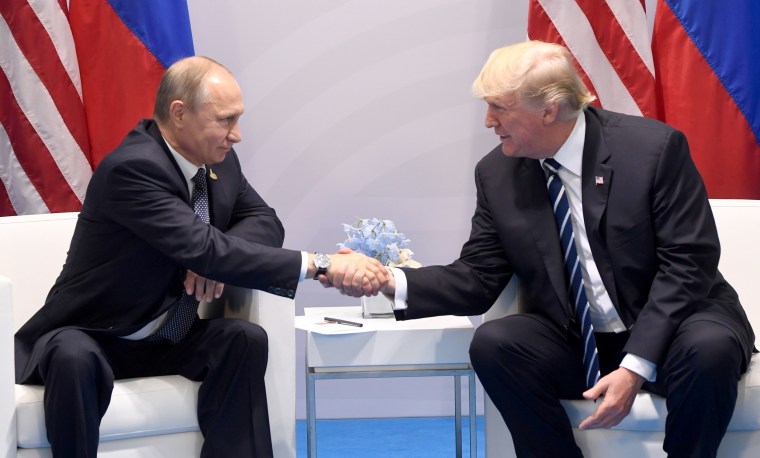 Image: U.S. President Donald Trump and Russia's President Vladimir Putin shake hands during a meeting on the sidelines of the G20 Summit in Hamburg, Germany, on July 7, 2017.