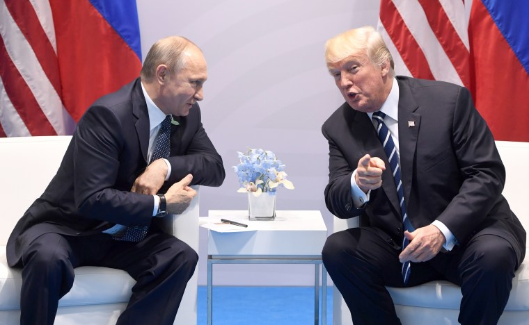 Image: U.S. President Donald Trump and Russia's President Vladimir Putin shake hands during a meeting on the sidelines of the G20 Summit in Hamburg, Germany, on July 7, 2017.