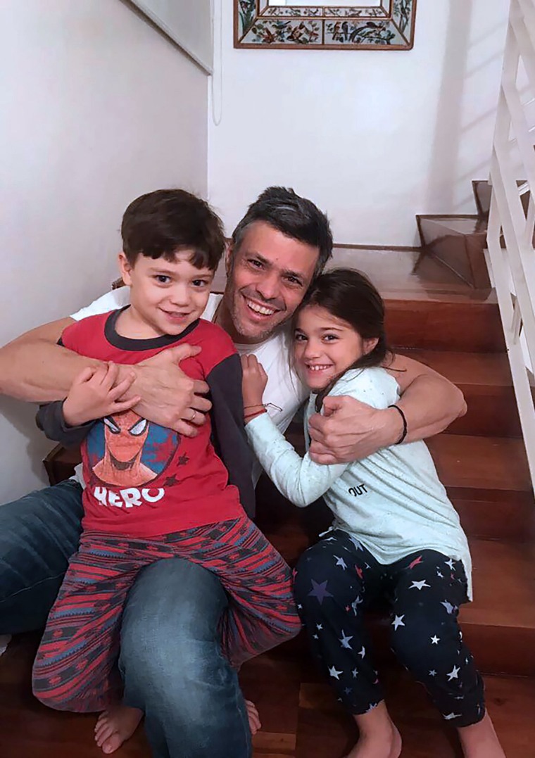 Image: Venezuelan opposition leader Leopoldo Lopez hugging with his children at his house in Caracas