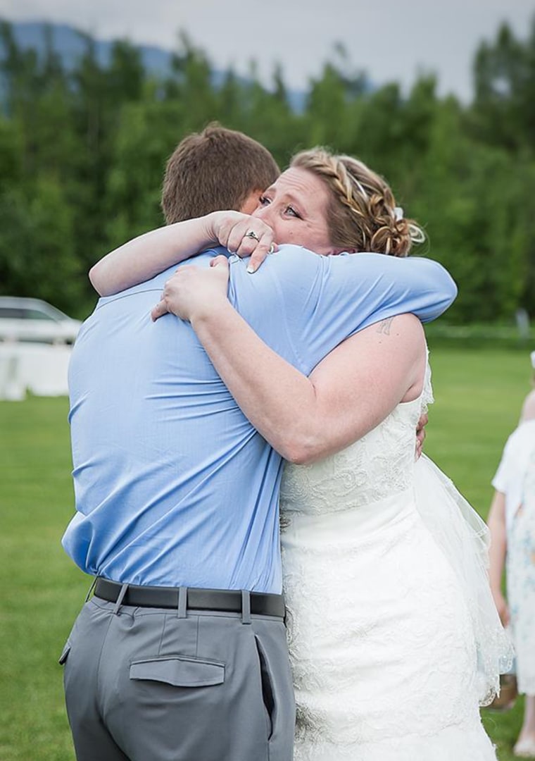 Jacob and Becky embracing after the emotional surprise.