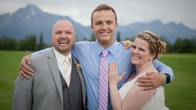 Becky and Kelly pose with their very special wedding guest.