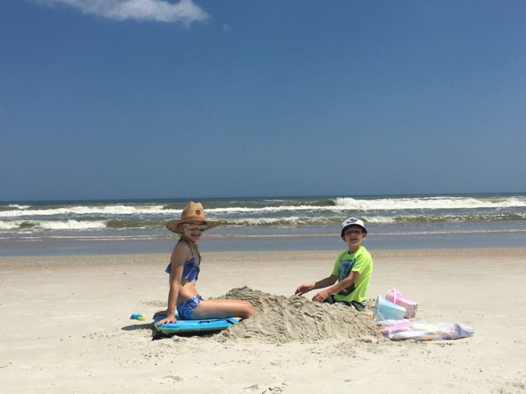 Tara Nardelli and her husband set their kids up on the beach 10 feet away from their own chairs to give themselves some space to connect far enough away that they can't hear their kids arguing. 